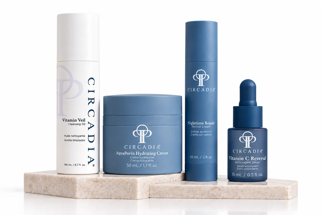 Circadia cleansing oil, hydrating cream, serum and vitamin C bottles on a stone tray